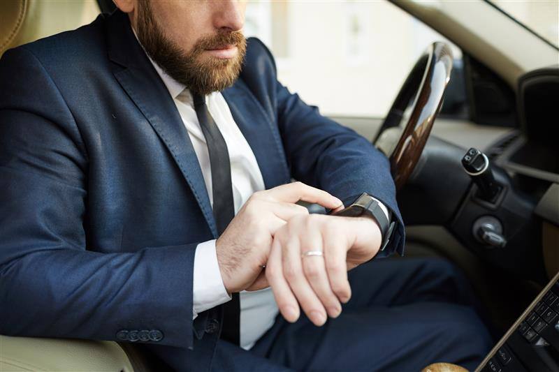 Checking_Watch_In_Car_original_810446